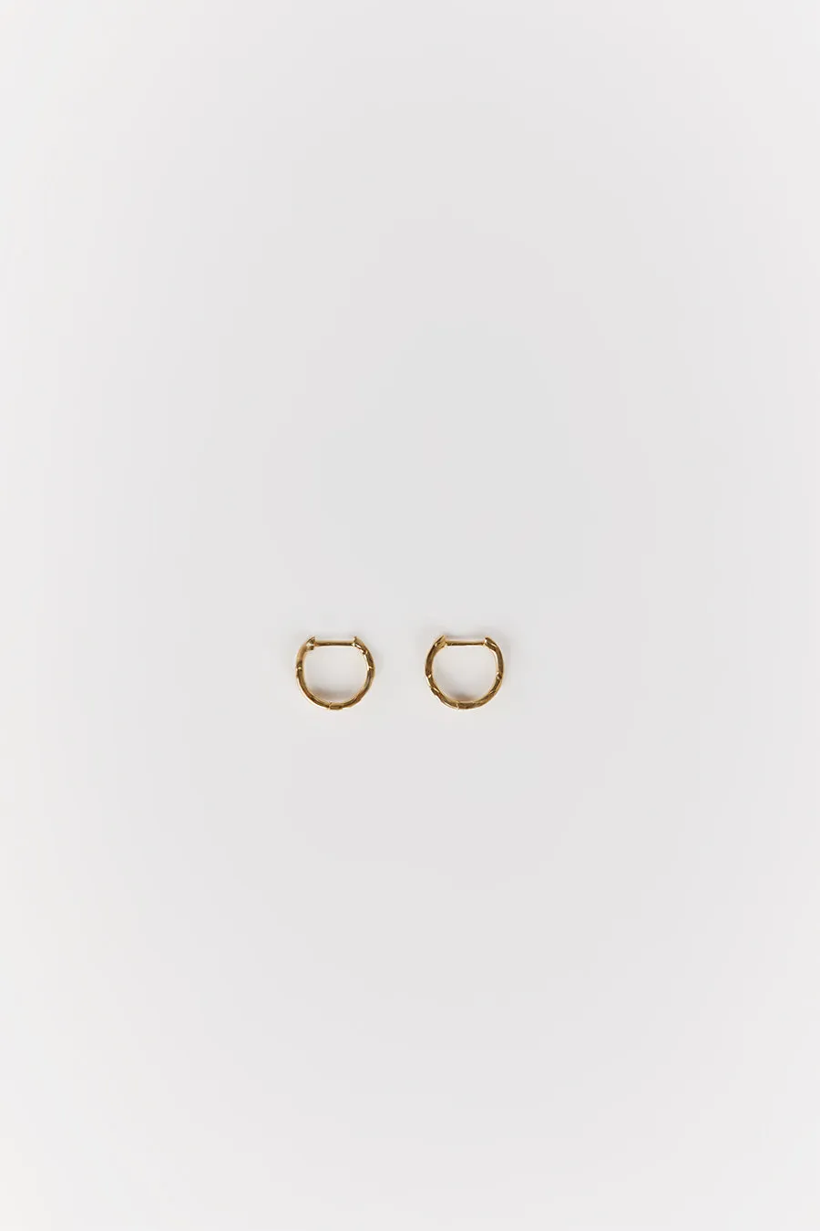 Dissh SAINT VALENTINE VERA WAVE GOLD HUGGIE EARRINGS